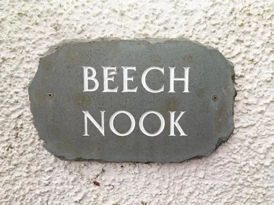 a sign that says beach nook on a wall at Beech Nook in Keswick