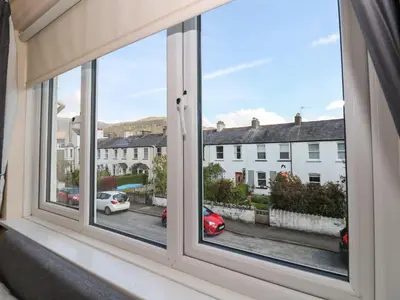 a window with a view of a street at Inglewood in Keswick