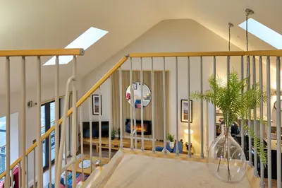 a room with a staircase with a potted plant at Riverside Park 5 in Keswick