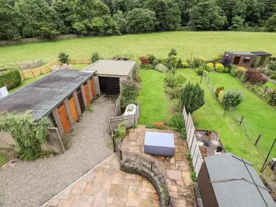 an aerial view of a garden with a building at 7 Stybarrow Terrace in Penrith
