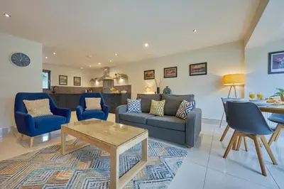 a living room with a couch and a table at Riverside Park 2 in Keswick