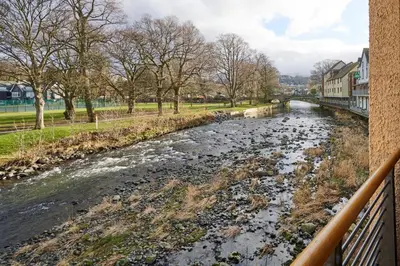 a river with a bunch of trash in it at Riverside Park 4 in Keswick