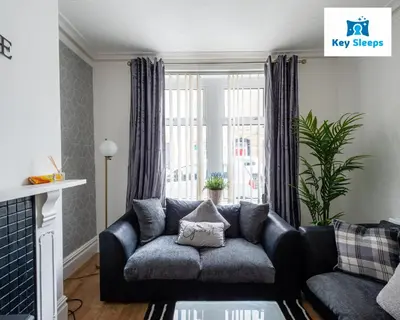 a living room with a couch and a window at NEW Four Bedroom House By Keysleeps Short Lets Workington Contractor Leisure Beach Location Lake District in Siddick