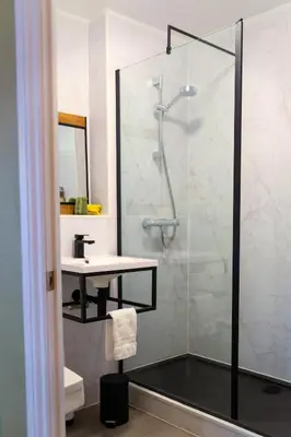 a bathroom with a shower and a sink at Bojangles Guest House in Gretna Green