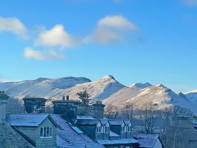 a group of houses with mountains in the background at Keswick View in Keswick