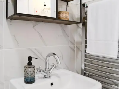 a bathroom sink with a soap dispenser on it at Cairnsmore - Uk34533 in Newton Stewart