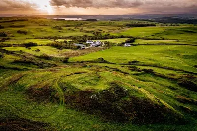 an aerial view of a field of green grass at The Kites Rest at Castle Creavie Farm in Kirkcudbright