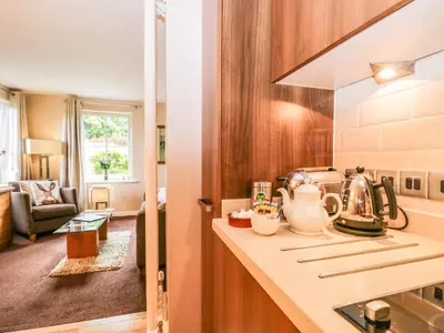 a kitchen with a counter with a tea kettle at Cosy Corner in the Lakes in Penrith
