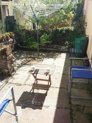 a bench and a table in a yard at Haven Apartments in Whitehaven