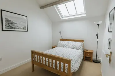 a bedroom with a bed and a window at ELM HOUSE COTTAGE - 2 Bed Cottage in High Hesket on the edge of the Lake District, Cumbria in High Hesket