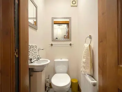 a small bathroom with a toilet and a sink at Beautiful Apartment - Outstanding Central Location - Pass the Keys in Dumfries
