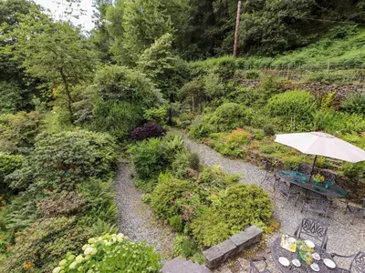 an overhead view of a garden with an umbrella at Huntingstile Lodge in Ambleside