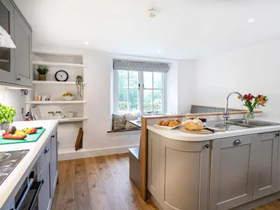 a kitchen with a sink and a counter top at Little How in Ambleside