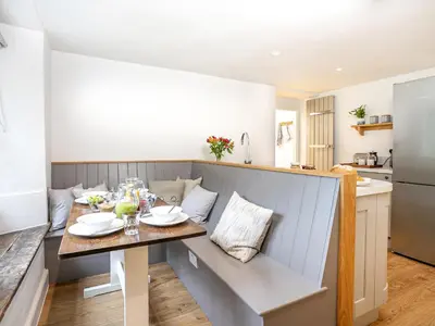 a kitchen and dining room with a table in a room at Little How in Ambleside