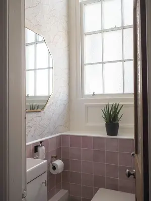 a bathroom with a sink and a toilet and a window at Coorie Away - Kirkcudbright in Kirkcudbright