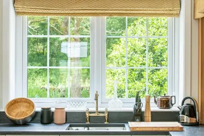 a kitchen with a sink and a window at Culdoach in Castle Douglas
