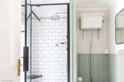 a shower with a glass door in a bathroom at Culdoach in Castle Douglas