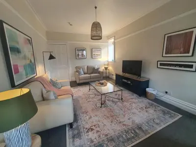 a living room with a couch and a tv at Grandy Nook in Keswick