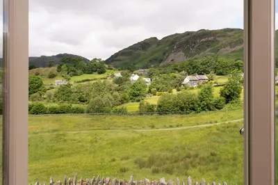 a view of a field from a window at Lowfield House in Ambleside