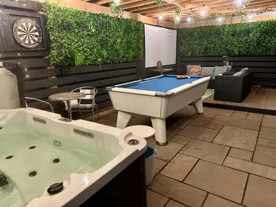 a room with a tub and a pool table at Bothy Farm Stay Sleeps 2 HotTub and Pool Table Children Welcome Ayrshire Rural Retreats in Newmilns