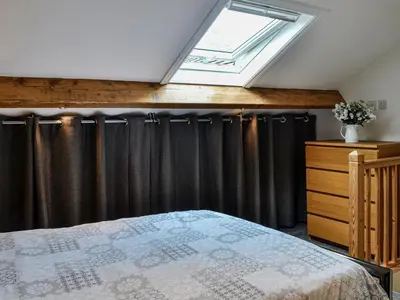 a bedroom with a bed and a window at The Annex in Crosby