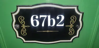 a black and white sign with the on it at Cosy apartment in popular harbour town in Kirkcudbright