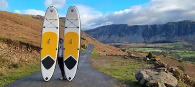 two surfboards are standing on a road at Wastwater Cottage on The Big 