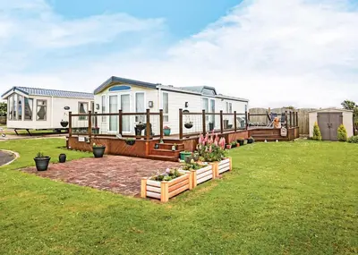 a home with a large yard with a house at Lyons Manor House in Maryport