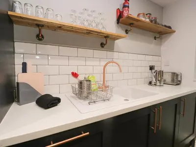 a kitchen counter top with a sink and a sink at Ravenglass Retreat in Ravenglass