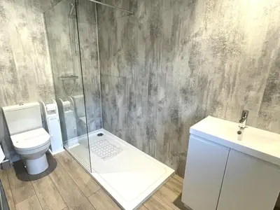 a bathroom with a shower and a toilet and a sink at Beautiful 5BR Rural Cottage with Outstanding Views - Pass the Keys in Castle Douglas