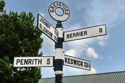 a street pole with street signs on it at Finest Retreats - The Cottage at Greystoke in Greystoke