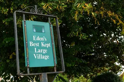 a sign that says elders best kept large village at Finest Retreats - The Cottage at Greystoke in Greystoke