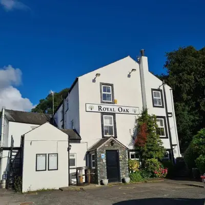 a white building with a sign that reads royal oak at Royal Oak Braithwaite in Keswick