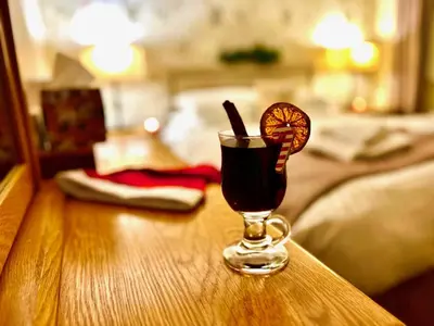 a drink in a glass sitting on a table at Royal Oak Braithwaite in Keswick
