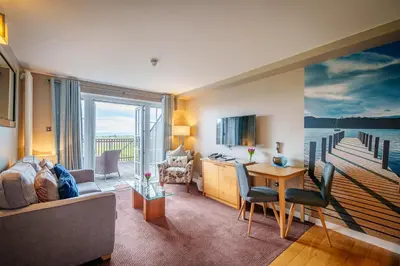 a living room with a view of the water at Bowscale Suite in Penruddock