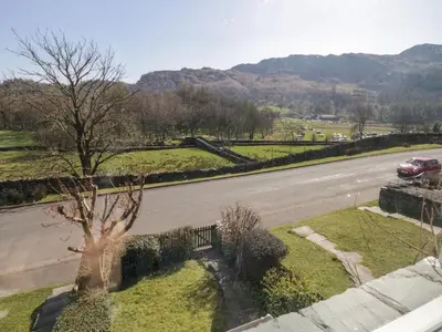 a view of a road with a car driving down a street at Fellside View in Ambleside