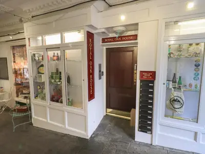 a store with glass doors and a sign on the wall at Peak View in Keswick