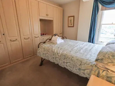 a bedroom with a bed and a window at Peak View in Keswick