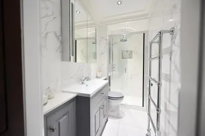 a white bathroom with a sink and a shower at The Old Manse in Ayr