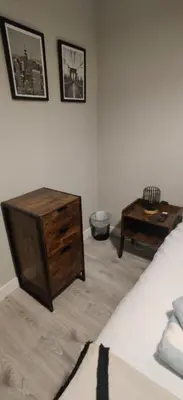 a bedroom with a bed and a coffee table at Anchors Rest in Ayr