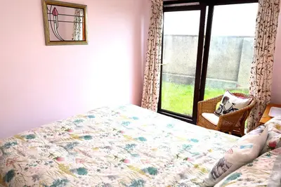 a bedroom with a bed and a window at Links Quay 42 in Prestwick