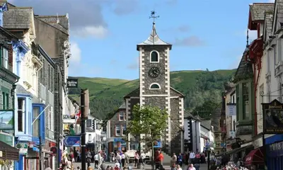 a town with a clock tower in the middle of a street at Thirty Blencathra Street in Keswick