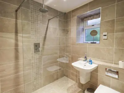 a bathroom with a shower and a sink and a toilet at Slaters Rest in Chapel Stile