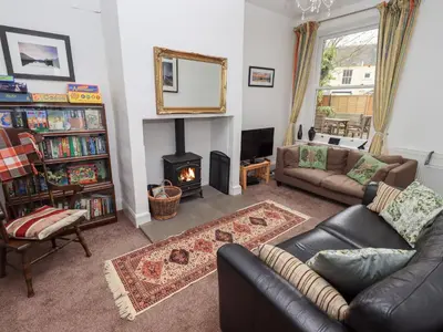 a living room with a couch and a fireplace at Number Twenty in Keswick