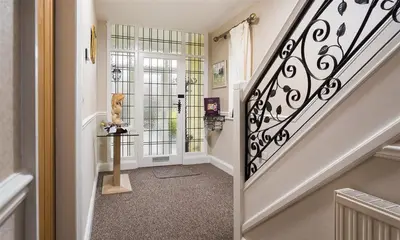 a staircase in a home with a stair case at Heathfield in Keswick