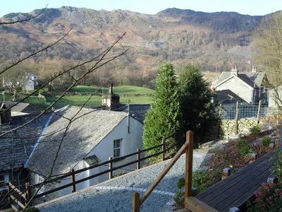 a view of a village with mountains in the background at White Lion Cottage in Chapel Stile
