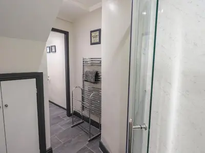 a hallway with a mirror and a walk in closet at Easedale in Grasmere