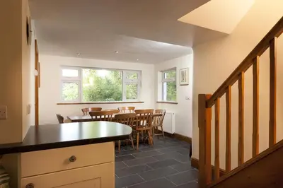 a kitchen and dining room with a table and chairs at Wythebank in Ambleside
