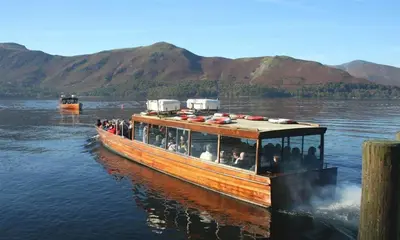 a group of people on a boat on the water at Little Leveret Cottage in Keswick