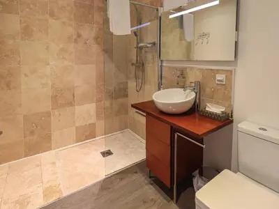 a bathroom with a sink and a shower at Le Chalet in Elterwater